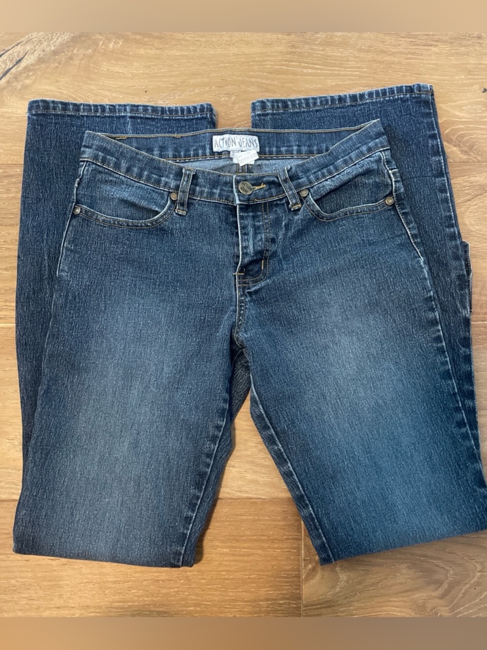 Low rise flare dark wash action jeans with buckles